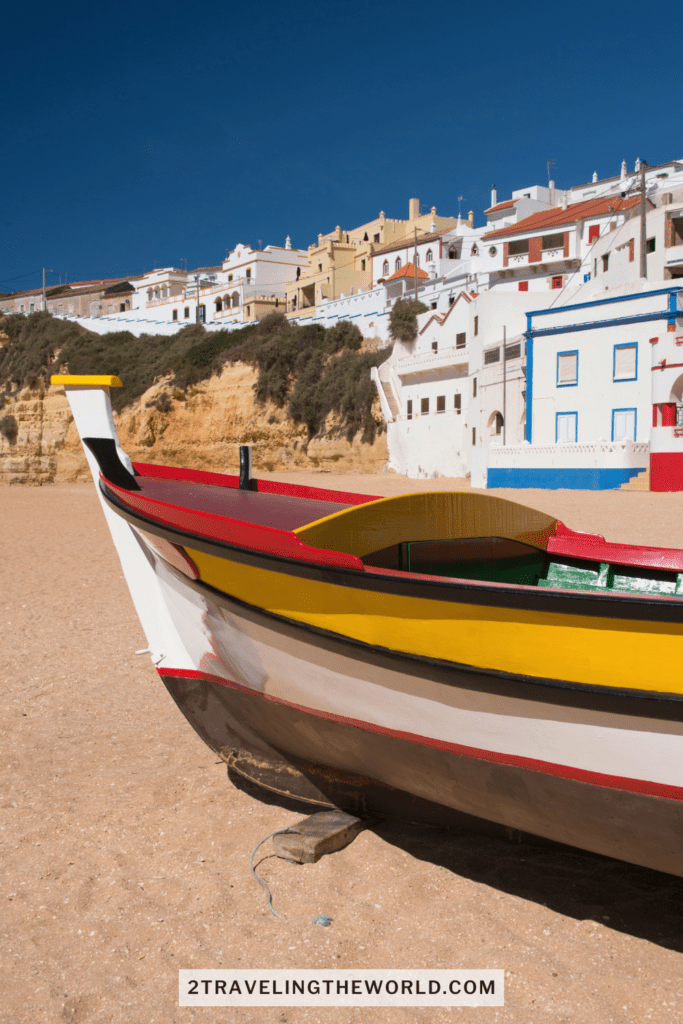 Travel Portugal: boat sitting  on sandy beach in Algarve