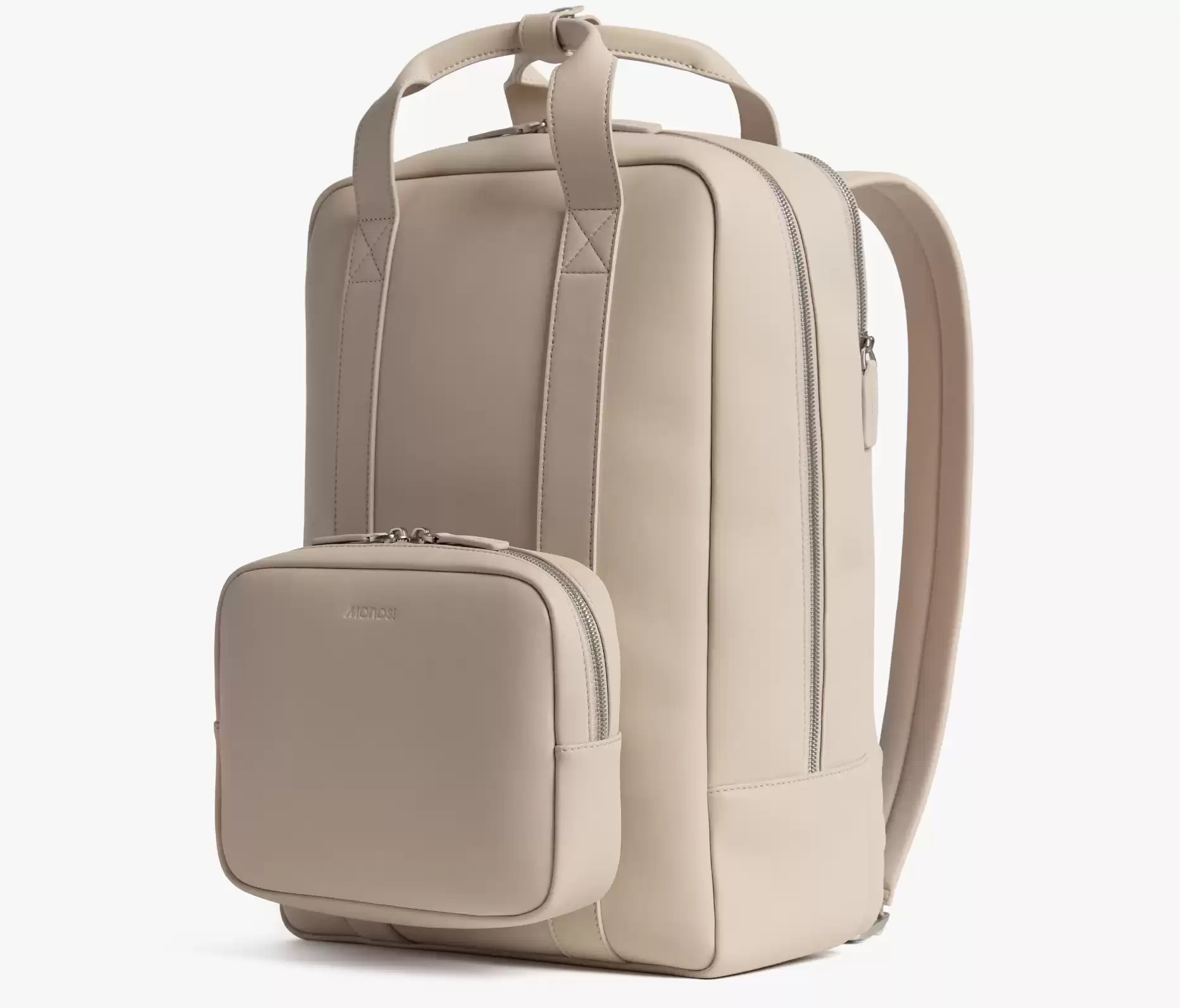 Monos Metro Backpack that adds a sleek yet practical piece to your travel outfits.