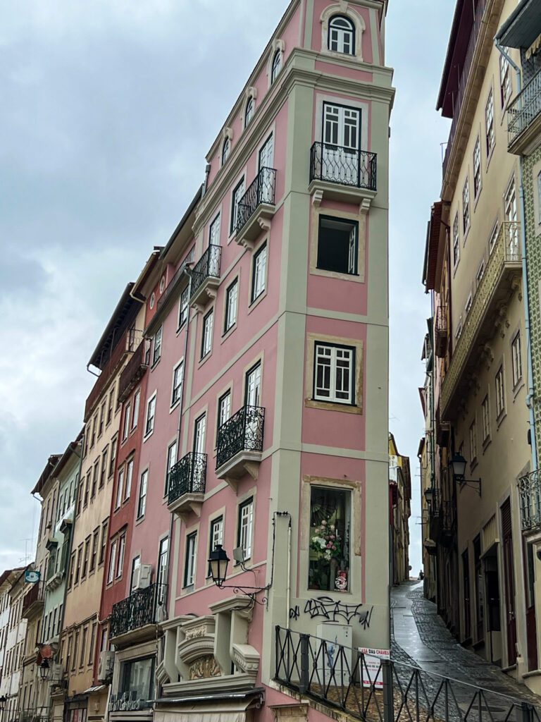pink building and Narrow Streets that branch off the Old town of Coimbra