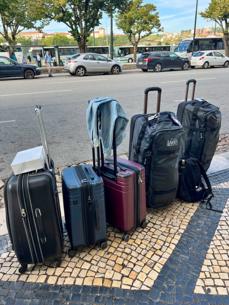 picture of our luggage we had to walk with because the charming city of coimbra portugal has streets many streets with no cars
