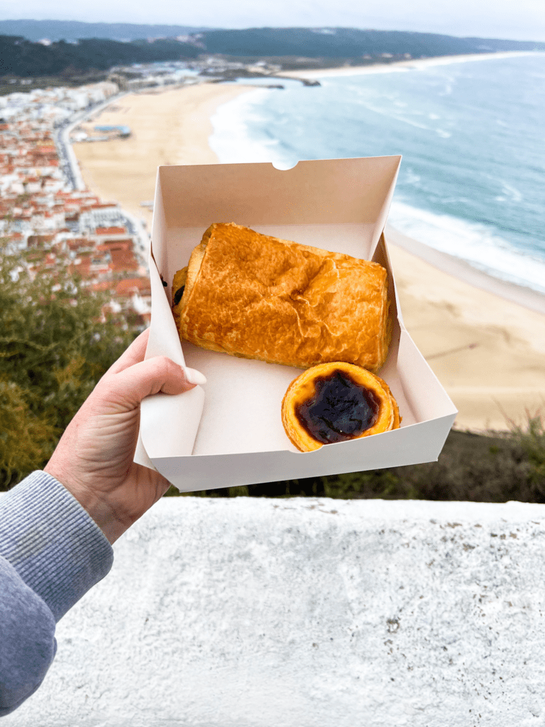 Exploring Nazare beach towns in Portugal. took funicular to top and ordered pastel de nata pastry