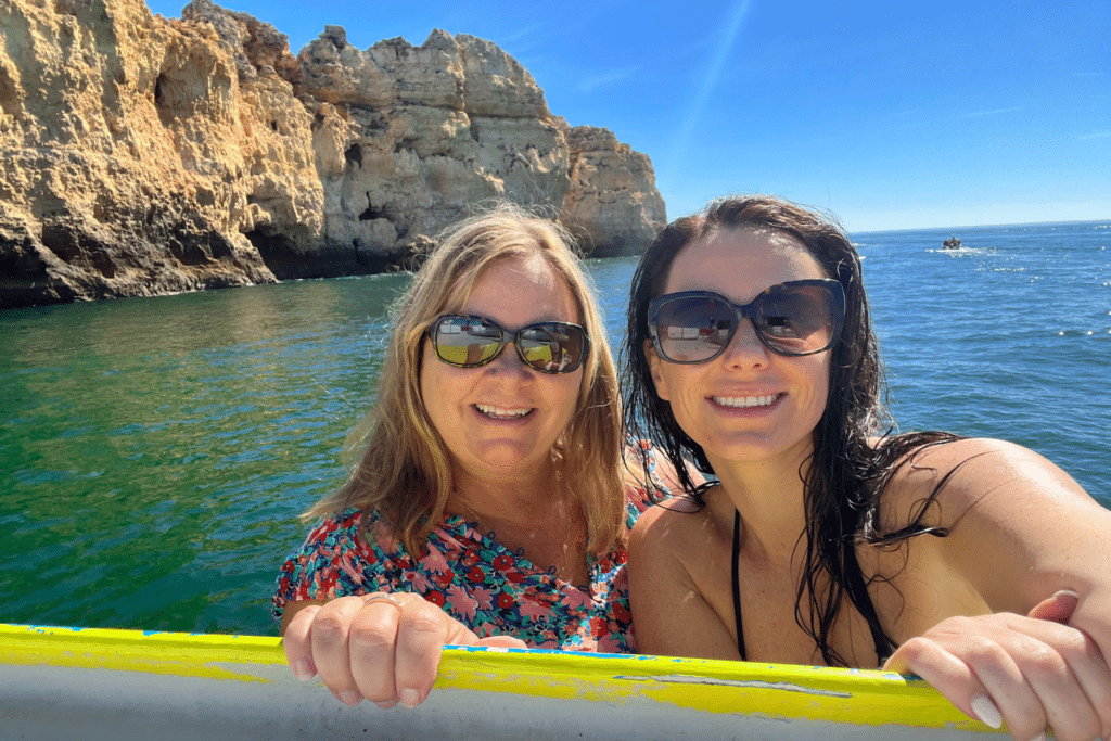 boating by beautiful beaches and exploring caves like the benagil cave while visiting Portugal.
