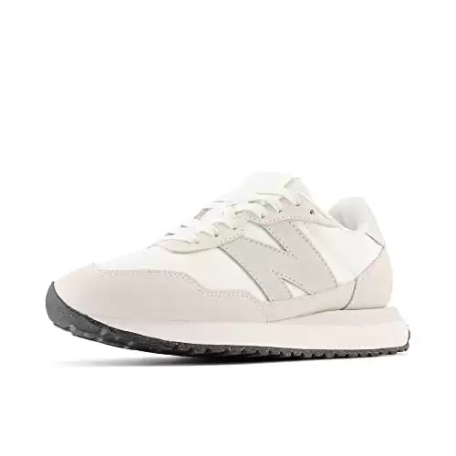 white and grey New balance sneakers that you can wear in the aport or out exploring a new city