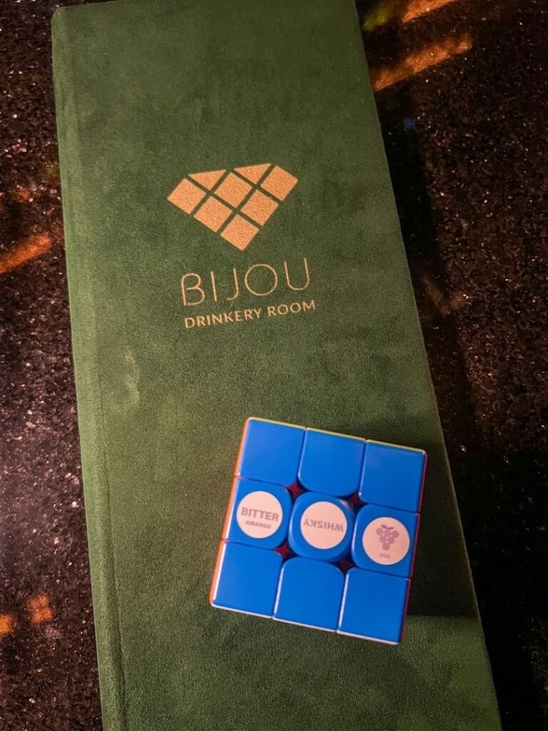 A picture of a Mexico City Cocktail bar menu called Bijou which is a rubix cube themed speakeasy.