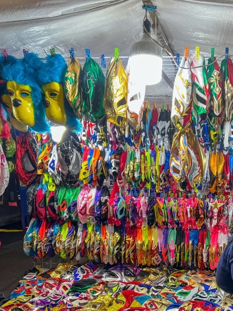 Vendors outside of Lucha Libre show selling masks