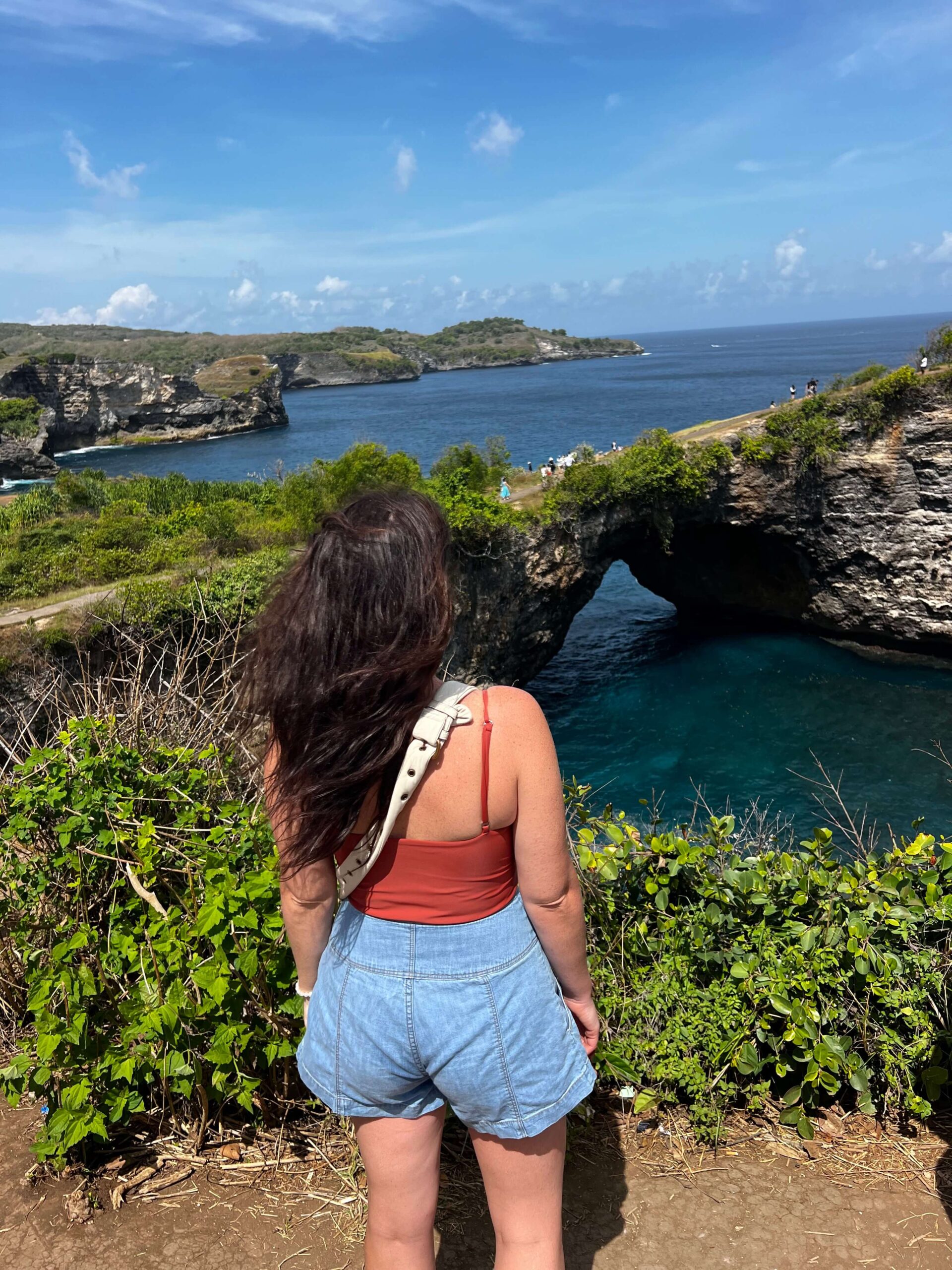 Woman standing at Broken Beach on Nusa Penida