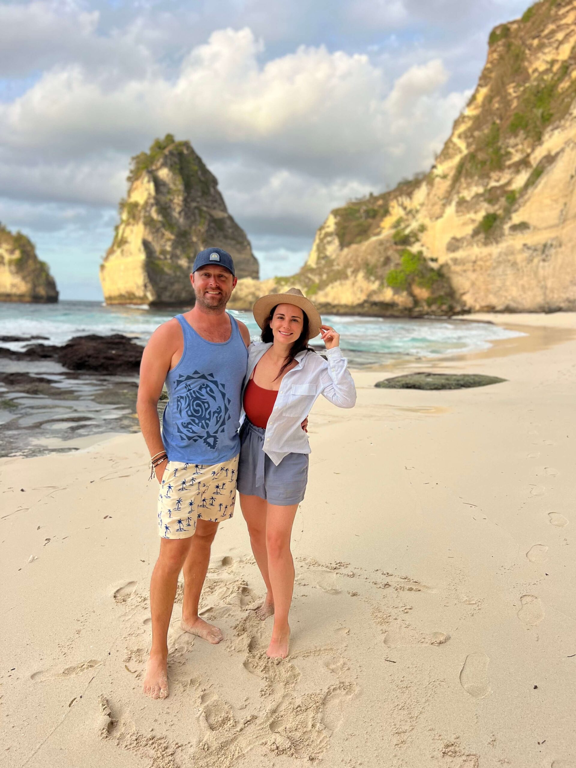 man and woman on nusapenida white sand beach during Atuh Beach stay in Nusa Penida