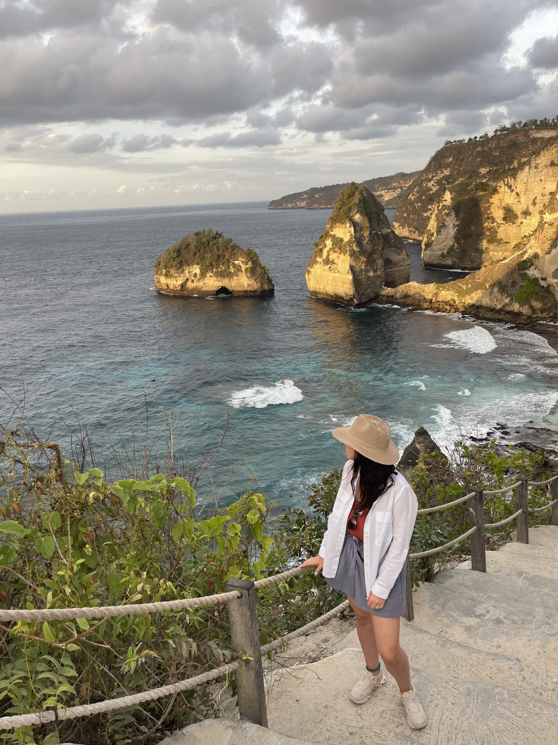 woman taking in spectacular panoramic views at Diamond Beach on Nusa Penida