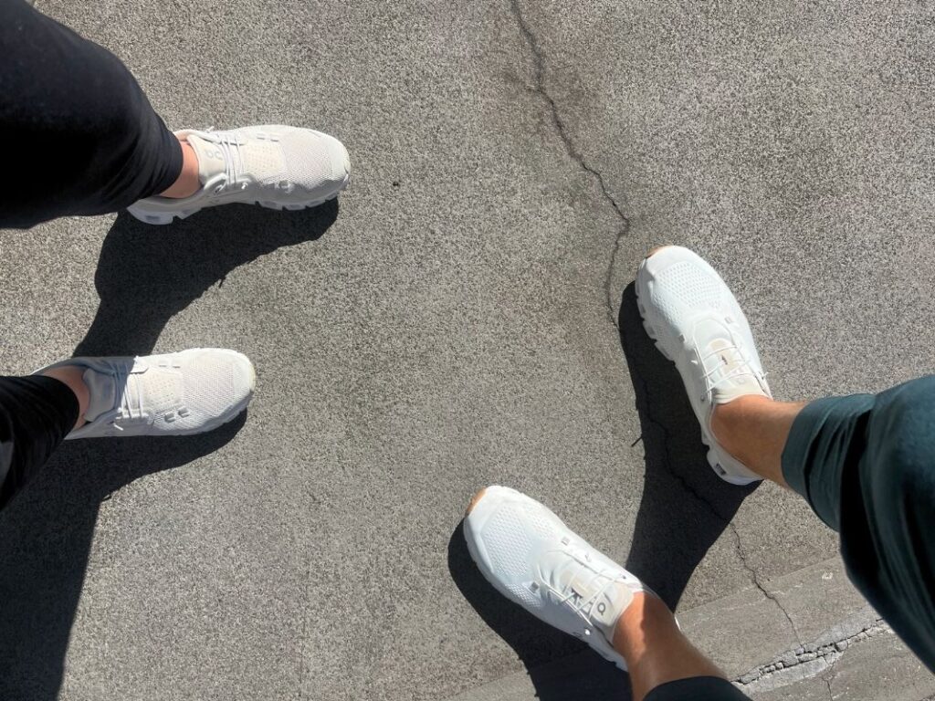 Michael and Jordyn showing two pairs of the On Cloud 5 Travel Walking shoes 1