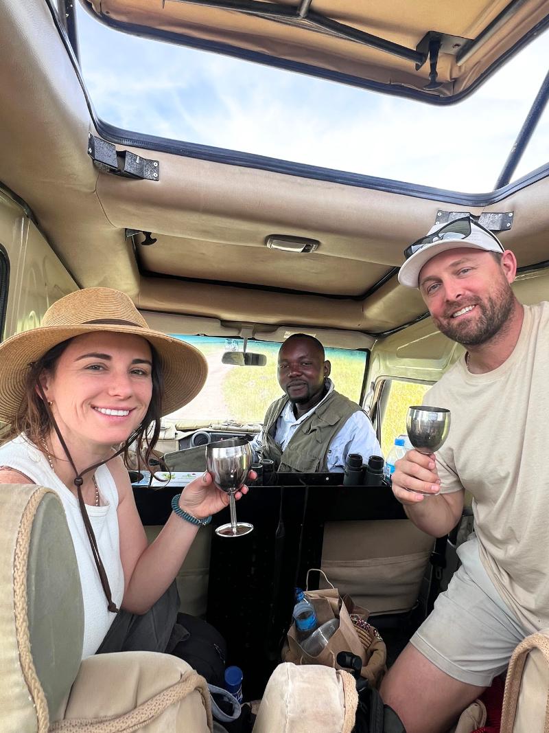 michael and jordyn from 2travelingtheworld smiling with their safari trip driver Haibibo on a safari adventure with Spirit of Kenya in East Africa